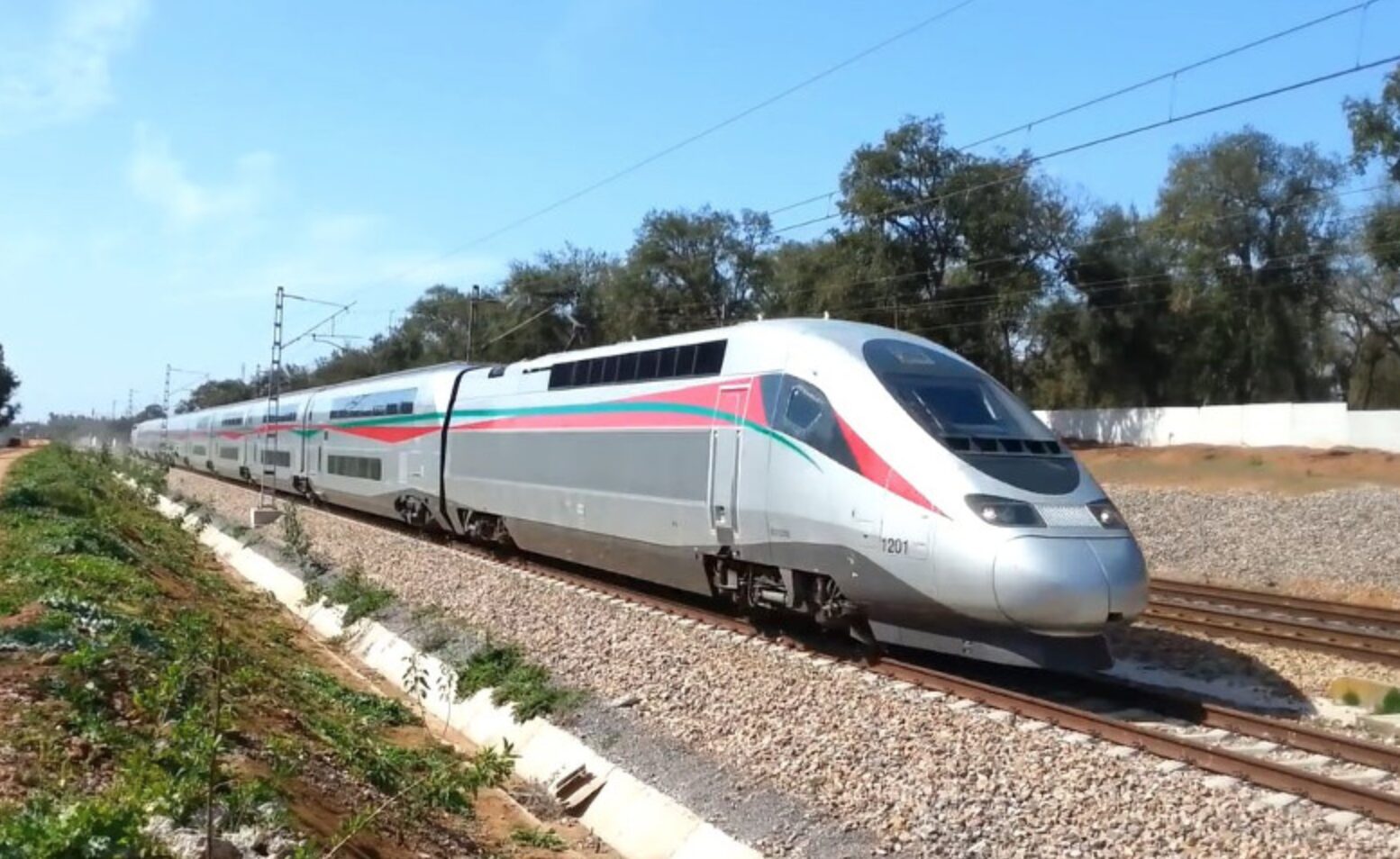 ONCF train near Marrakech platform at golden hour — Casablanca to Marrakech route