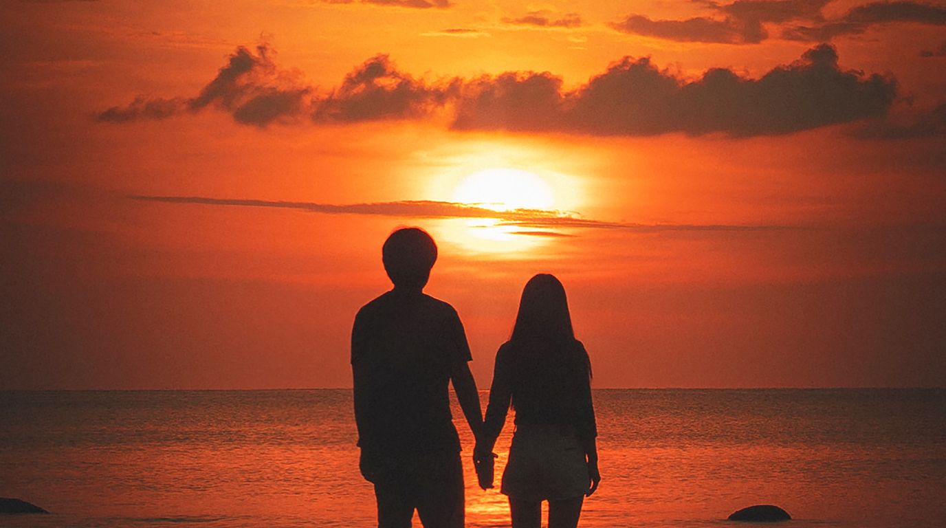 Silhouette of a couple holding hands at sunset in Morocco